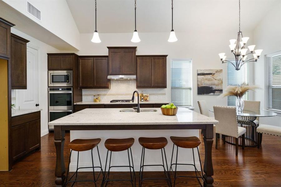 Designed for good times and great food, this kitchen’s got a wide island, double ovens, and an oversized pantry — plenty of room to prep and party this holiday season!