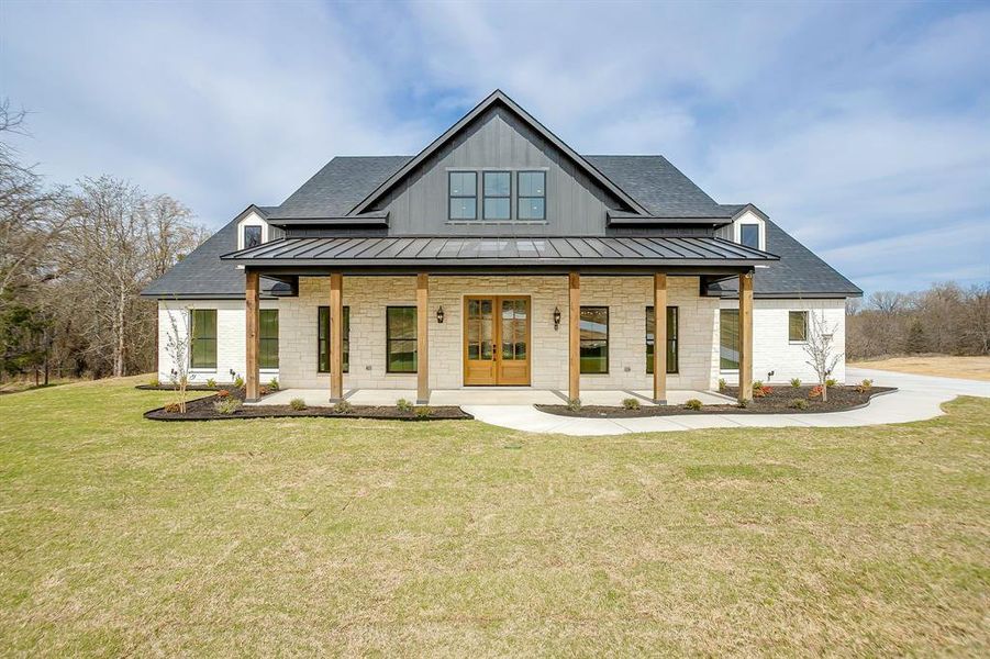 Front exterior of a new home in , Poolville, TX, highlighting curb appeal (Image 1). Front exterior of a new home in , Poolville, TX, highlighting curb appeal (Image 1).