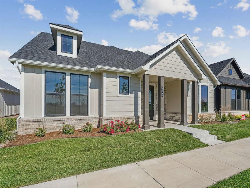 Front exterior of a new home in The Courtyards at The Moorings, Wichita, KS, highlighting curb appeal (Image 2). Front exterior of a new home in The Courtyards at The Moorings, Wichita, KS, highlighting curb appeal (Image 2).