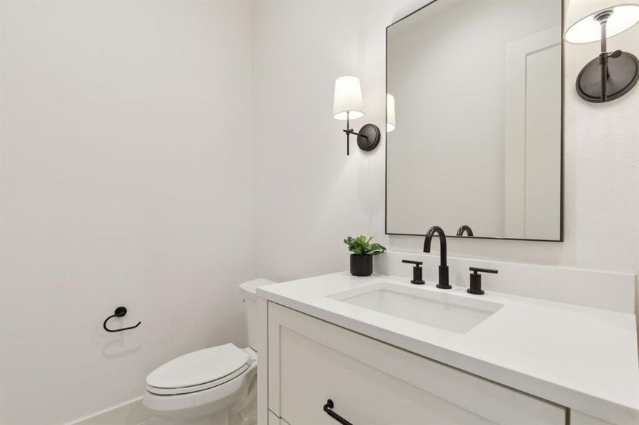 Bathroom featuring toilet and vanity