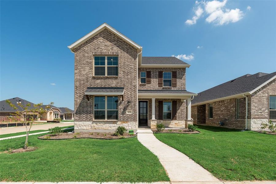 Front exterior of a new home in Arbors at Legacy Hills, Celina, TX, highlighting curb appeal (Image 2).