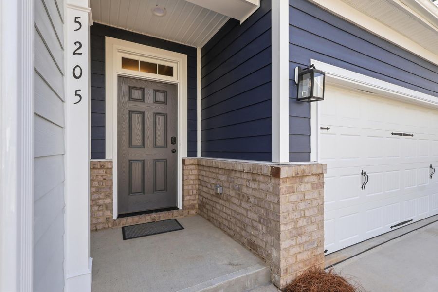 Exterior details and patio area of a home in Harbor Crossing, Greensboro (Image 3).