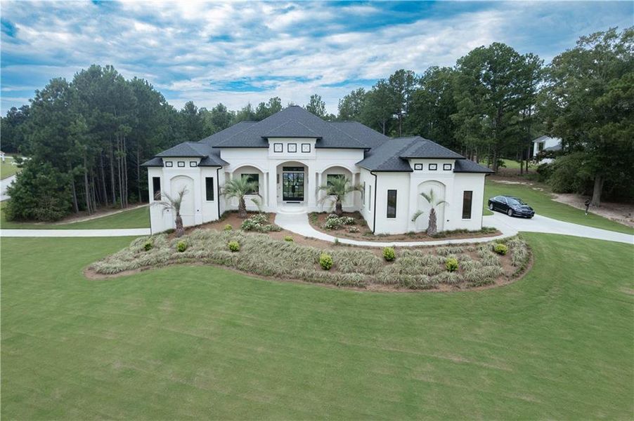 Front exterior of a new home in , Stockbridge, GA, highlighting curb appeal (Image 20).