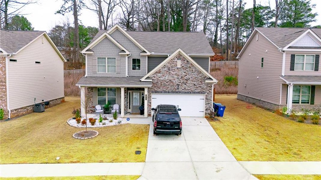 Front exterior of a new home in , Lawrenceville, GA, highlighting curb appeal (Image 21).