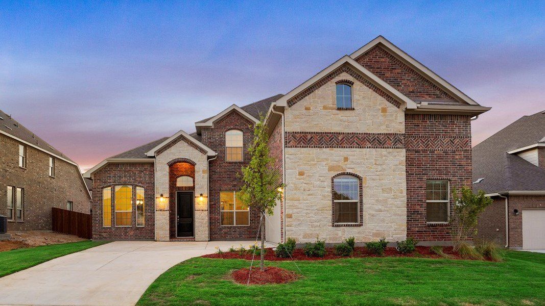 Representative exterior photo of a completed home built from the Valley spring by D.R. Horton in Lakeview Pointe, Grand Prairie, TX (Image 20).