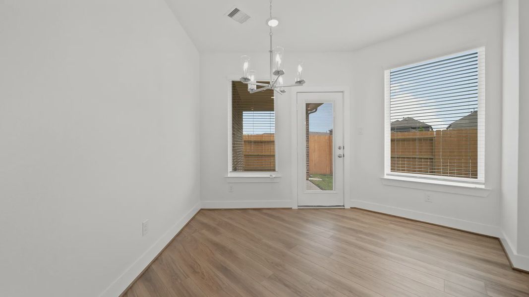 Representative unfurnished interior of a home built from the Rosewood by Chesmar Homes in Sienna Courtyard, Missouri City (Image 11).