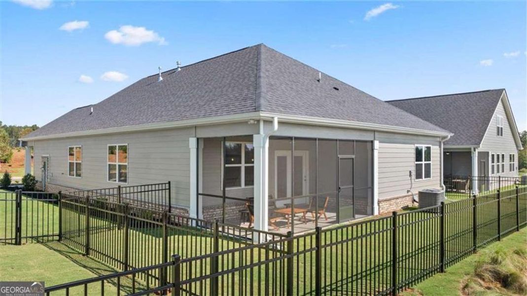Exterior details and patio area of a home in Oak Ridge Meadows - Active Adult, Locust Grove (Image 3).