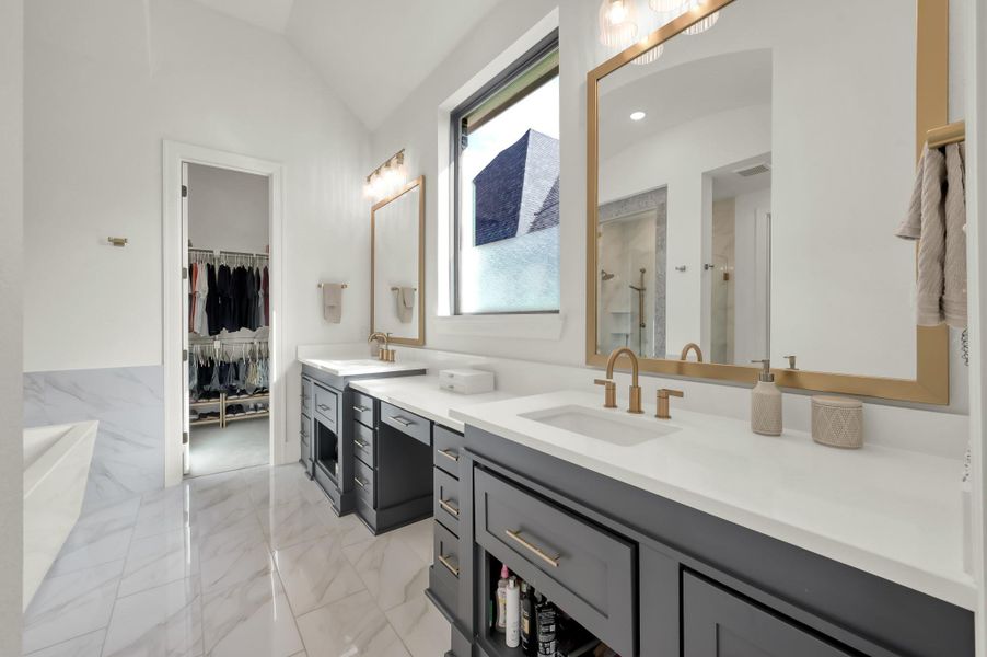 Dual vanities and generous storage provide both beauty and convenience.