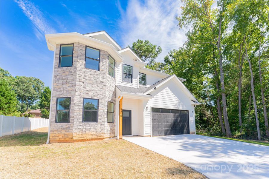 Front exterior of a new home in , Charlotte, NC, highlighting curb appeal (Image 21). Front exterior of a new home in , Charlotte, NC, highlighting curb appeal (Image 21).