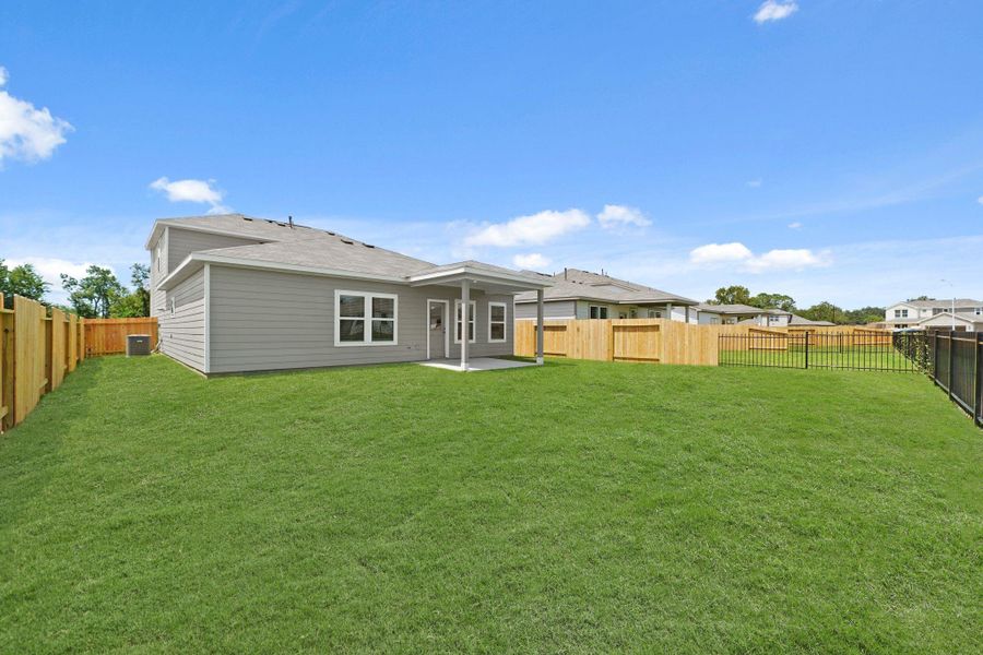 Exterior details and patio area of a home in Russell Ranch, Bay City (Image 4).