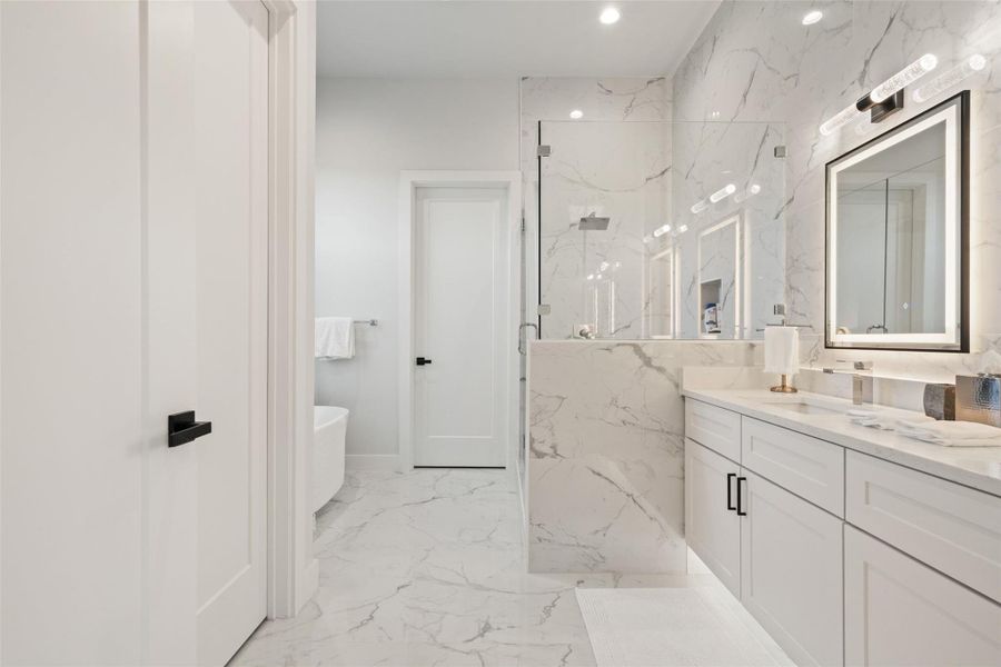 A beautifully appointed guest suite on the main floor ensures comfort and privacy for visitors.