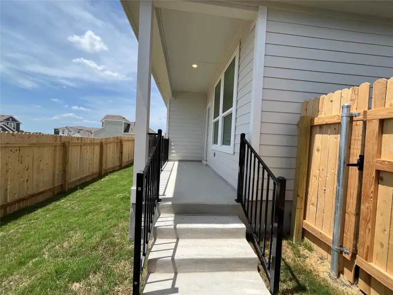 Exterior details and patio area of a home in Wellspring, Hutto (Image 1). Exterior details and patio area of a home in Wellspring, Hutto (Image 1).