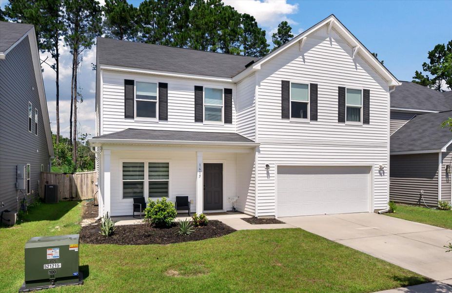 Front exterior of a new home in , Charleston, SC, highlighting curb appeal (Image 20).