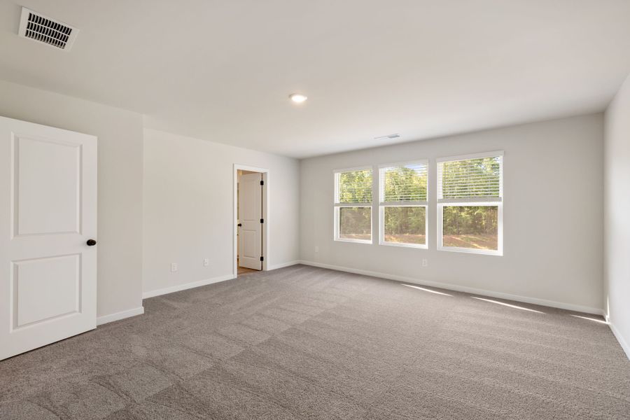 A room with a door and windows. A room with a door and windows.