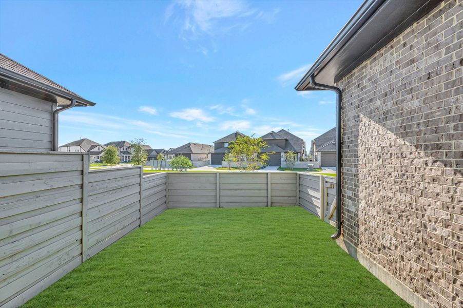 Exterior details and patio area of a home in Pomona - Grove Row Collection, Manvel (Image 4).
