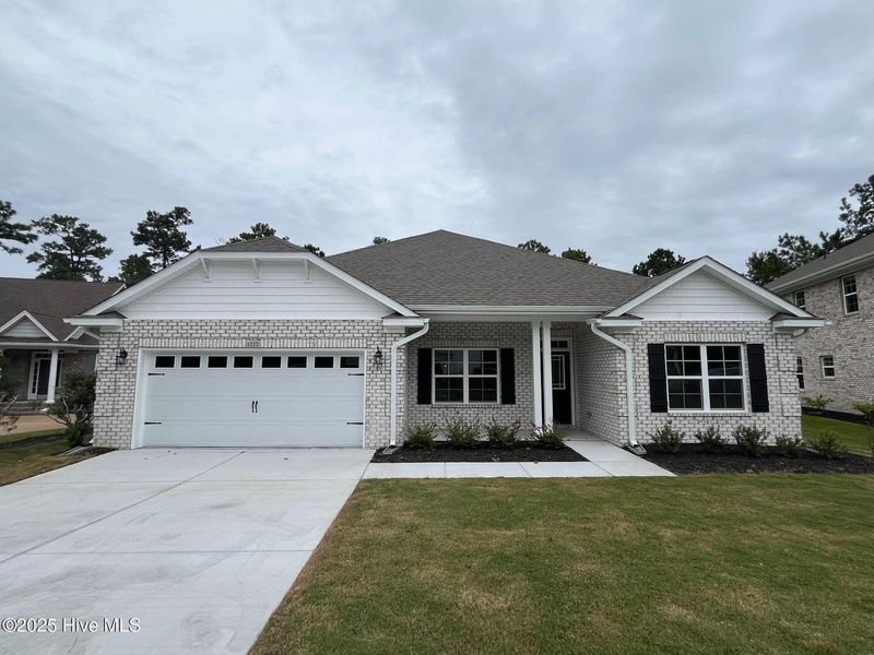 Front exterior of a new home in Palmetto Creek, Bolivia, NC, highlighting curb appeal (Image 1). Front exterior of a new home in Palmetto Creek, Bolivia, NC, highlighting curb appeal (Image 1).