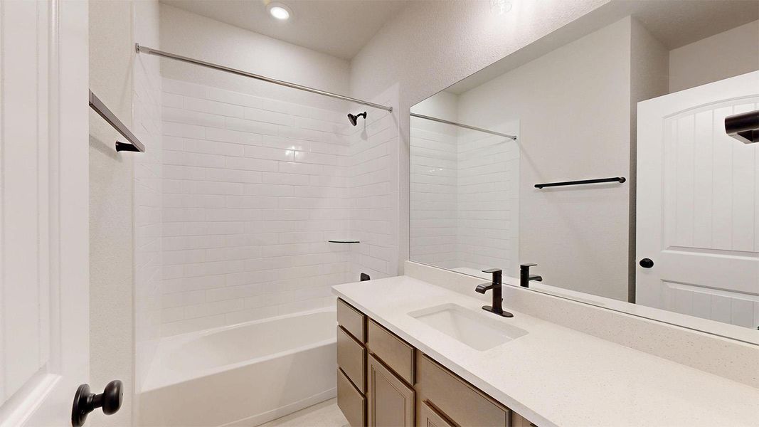 Full bathroom with vanity, bathtub / shower combination, and recessed lighting