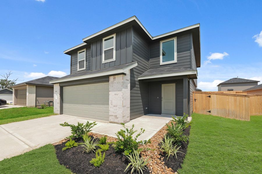 Front exterior of a new home in Mill Creek, Magnolia, TX, highlighting curb appeal (Image 1). Front exterior of a new home in Mill Creek, Magnolia, TX, highlighting curb appeal (Image 1).