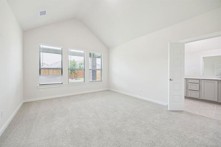 Primary Suite in the Claret home plan by Trophy Signature Homes  REPRESENTATIVE PHOTO