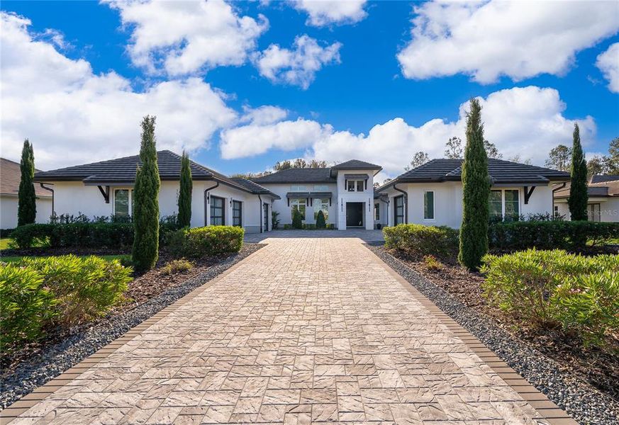 Front exterior of a new home in , Montverde, FL, highlighting curb appeal (Image 21). Front exterior of a new home in , Montverde, FL, highlighting curb appeal (Image 21).