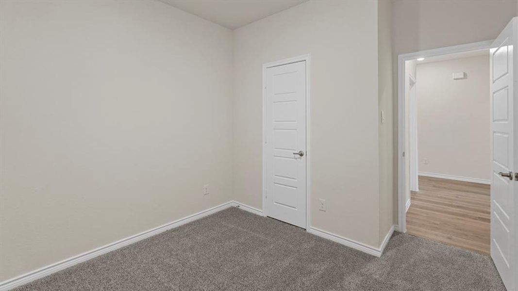 Unfurnished bedroom with baseboards and carpet floors Unfurnished bedroom with baseboards and carpet floors