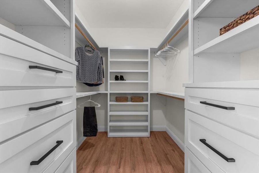 Walk in closet featuring light hardwood / wood-style flooring