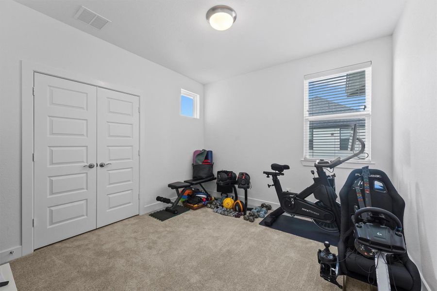 This versatile room can serve as a secondary bedroom, a home gym, or a playroom. Its flexibility allows you to customize the space to suit your specific lifestyle needs.