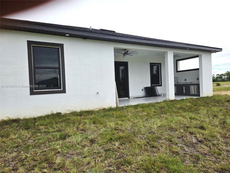 Front exterior of a new home in , Cape Coral, FL, highlighting curb appeal (Image 1).