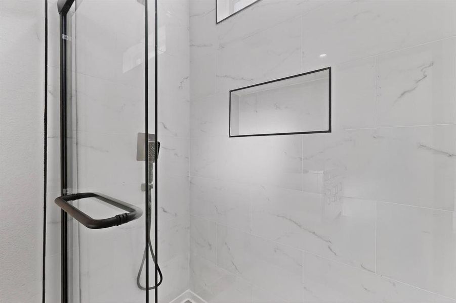 Bathroom view of a marble finish shower Bathroom view of a marble finish shower