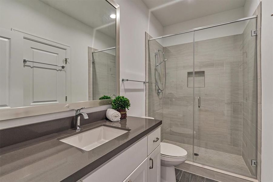 Secondary bathroom with shower and quartz countertop!