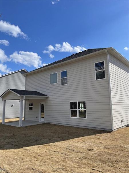 Front exterior of a new home in Emerald Oaks Estates, Rome, GA, highlighting curb appeal (Image 2).