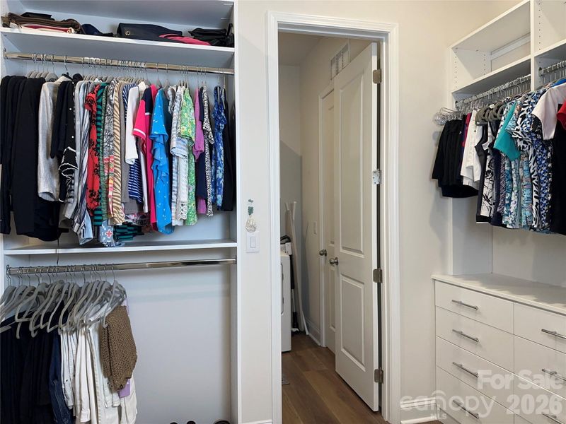 Large Primary Closet with Custom Built-Ins Off Primary Bath