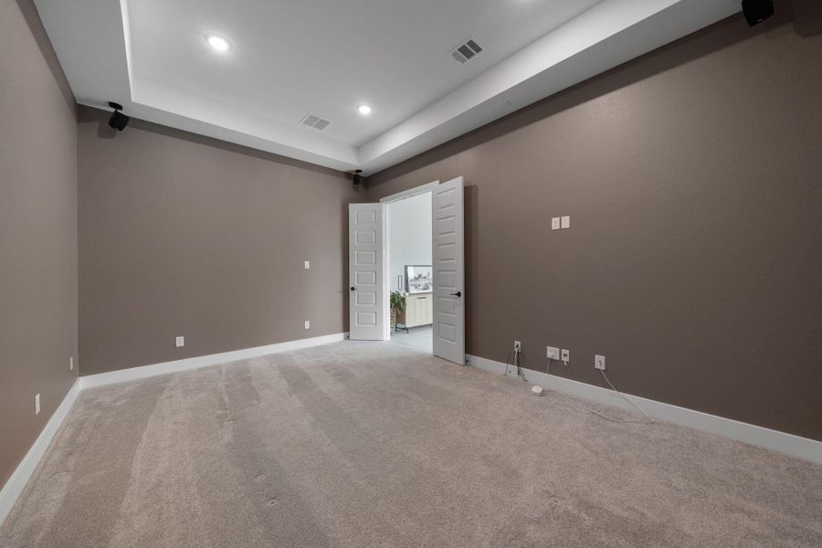 he space is ready to set up for a home theater system, with plenty of room for seating and entertainment. he space is ready to set up for a home theater system, with plenty of room for seating and entertainment.