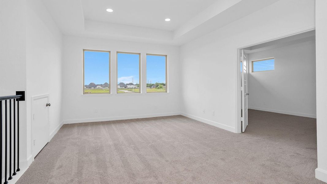 Spacious, unfurnished interior of a new home in Legacy Prairie at Katy Court, Katy (Image 9).
