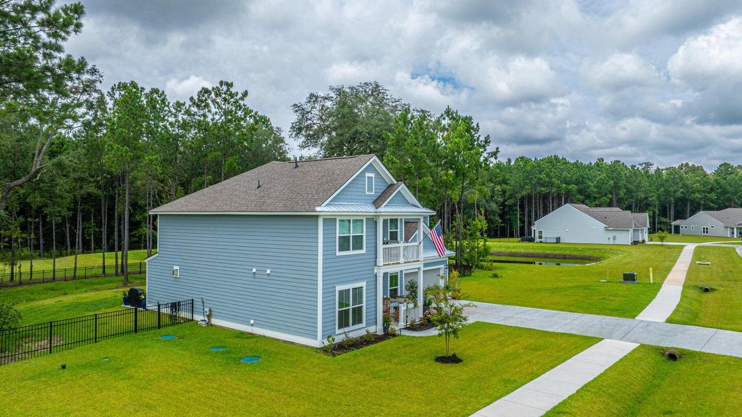 Front exterior of a new home in Sea Island Preserve, Johns Island, SC, highlighting curb appeal (Image 21). Front exterior of a new home in Sea Island Preserve, Johns Island, SC, highlighting curb appeal (Image 21).