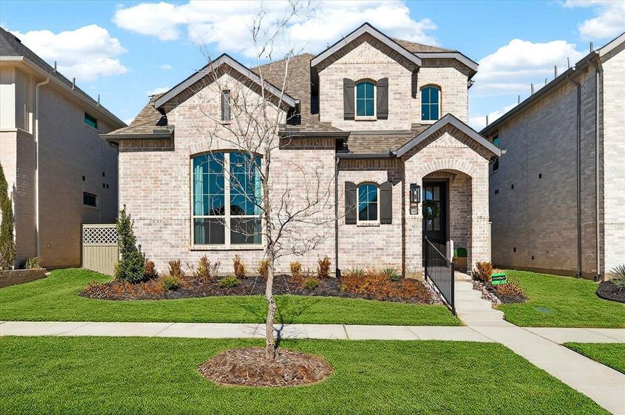 Front exterior of a new home in Pecan Square, Northlake, TX, highlighting curb appeal (Image 2).