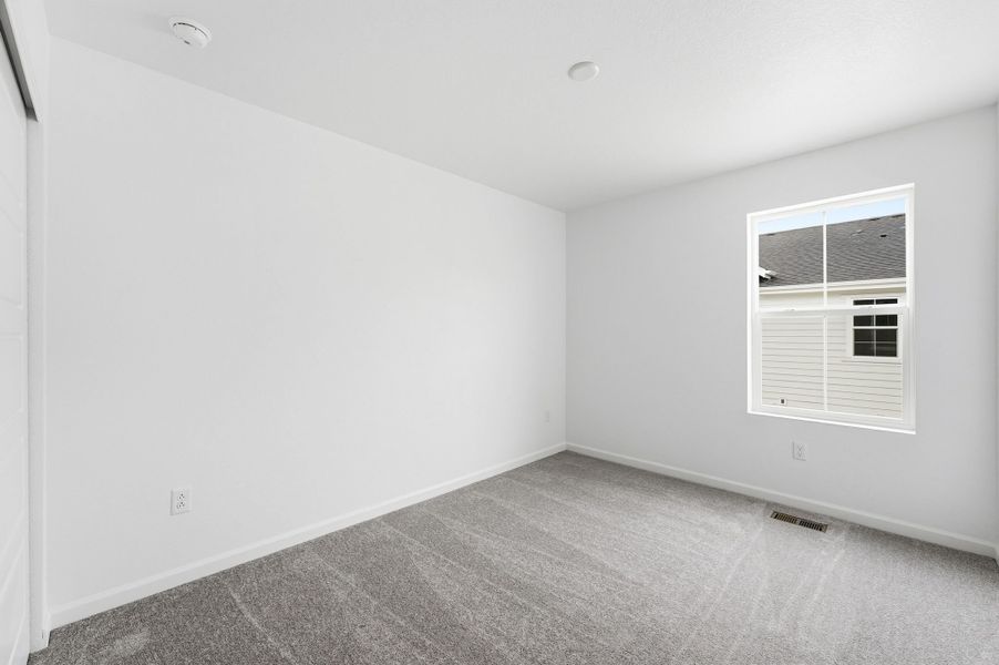 Spacious, unfurnished interior of a new home in Trailstone Townhomes - The Westerly Collection, Arvada (Image 16).