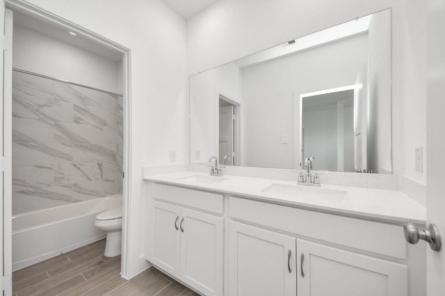 Furnished interior view inside a new home in Sunterra: Landmark Collection, Katy (Image 3).