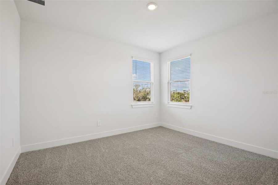 Spacious, unfurnished interior of a new home in Magnolia Bay - Reserve Series, Nokomis (Image 34).