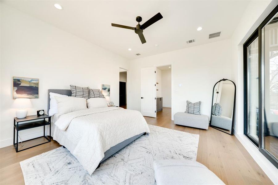 Bedroom with light hardwood / wood-style flooring and ceiling fan