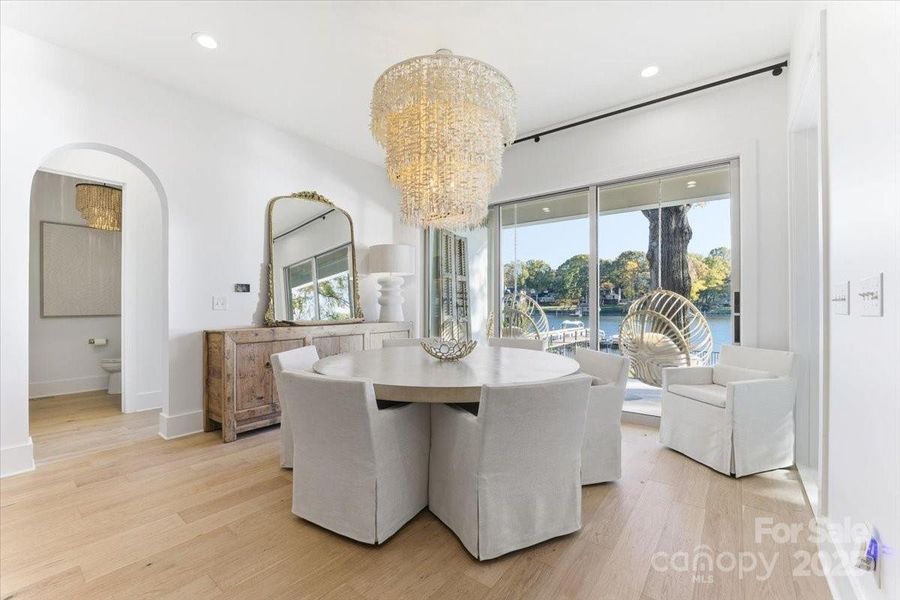 Waterfront Breakfast Area directly off the Kitchen and Great room with sliding glass doors to the covered patio. Waterfront Breakfast Area directly off the Kitchen and Great room with sliding glass doors to the covered patio.