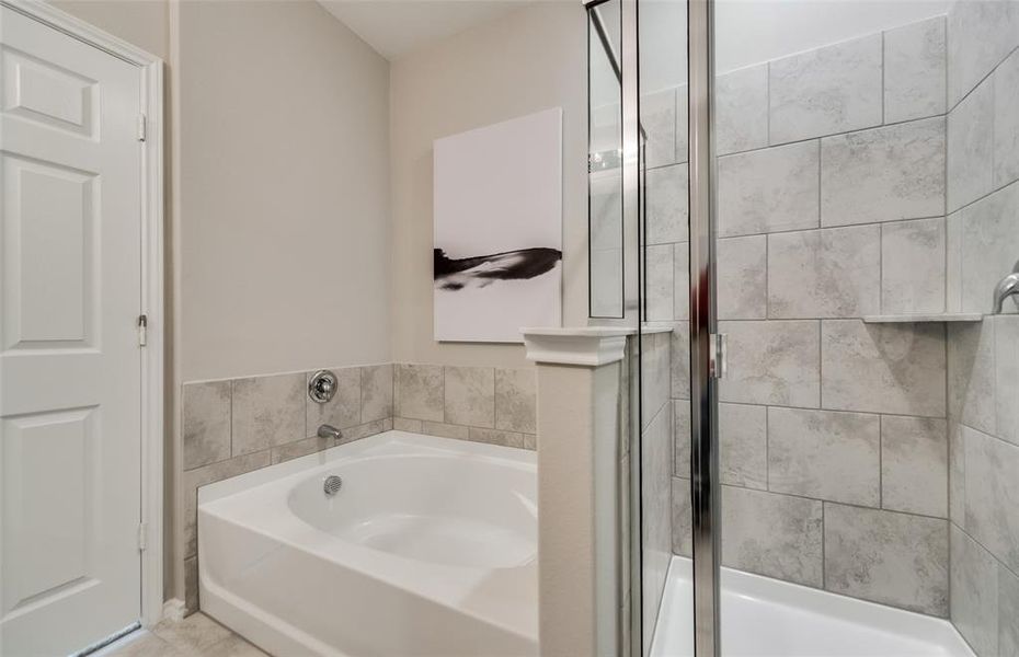 Elegant owner's bathroom with oversized shower *Photos of furnished model. Not actual home. Representative of floor plan. Some options and features may vary