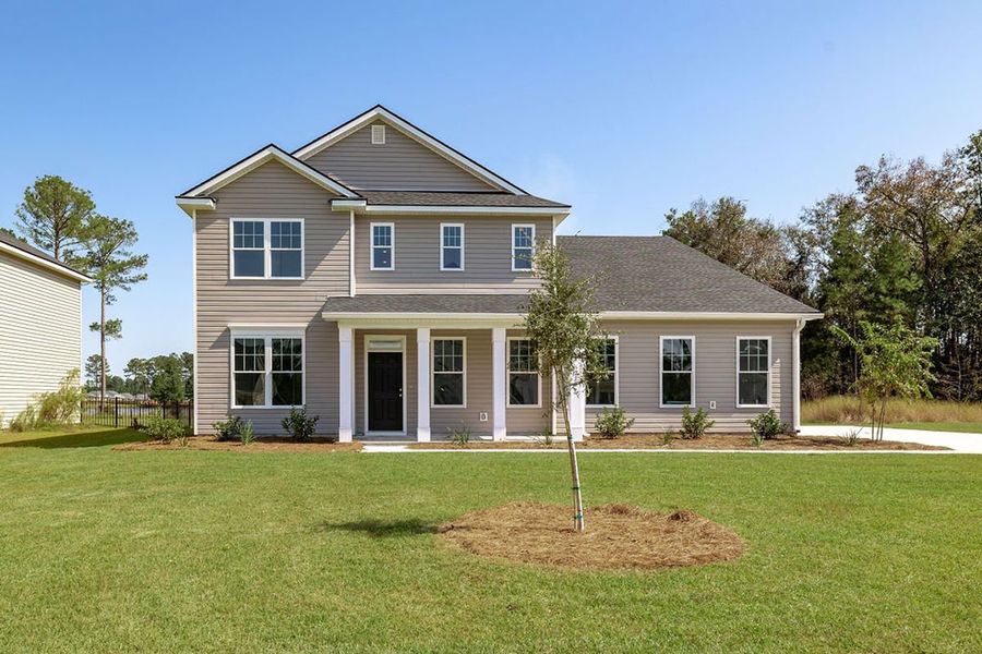 Representative exterior photo of a completed home built from the The Stonecrest by Smith Family Homes in Ramsey Landing, Rincon, GA (Image 26).