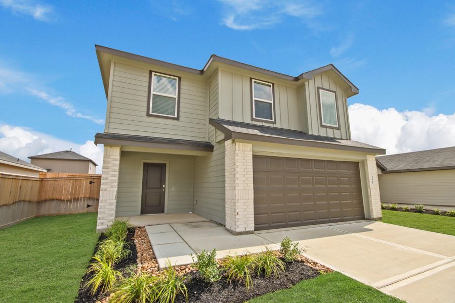 Front exterior of a new home in Mill Creek, Magnolia, TX, highlighting curb appeal (Image 2). Front exterior of a new home in Mill Creek, Magnolia, TX, highlighting curb appeal (Image 2).