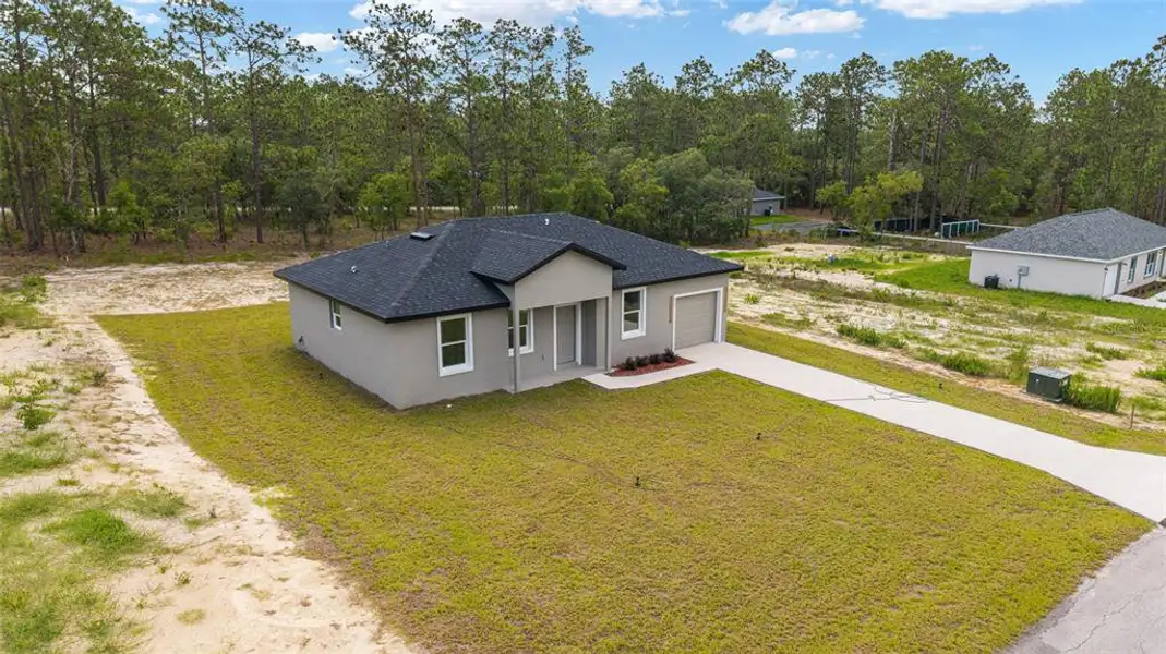 Front exterior of a new home in , Dunnellon, FL, highlighting curb appeal (Image 21). Front exterior of a new home in , Dunnellon, FL, highlighting curb appeal (Image 21).