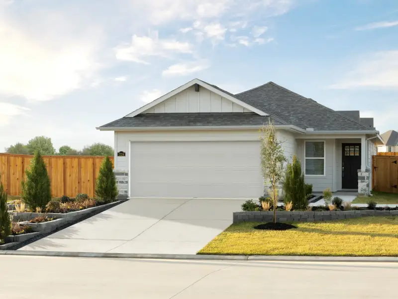 Front exterior of a new home in Riviera Pines - Traditional Series, Huffman, TX, highlighting curb appeal (Image 1). Front exterior of a new home in Riviera Pines - Traditional Series, Huffman, TX, highlighting curb appeal (Image 1).