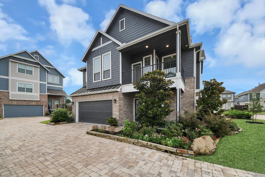 Front exterior of a new home in The Groves, Humble, TX, highlighting curb appeal (Image 26).