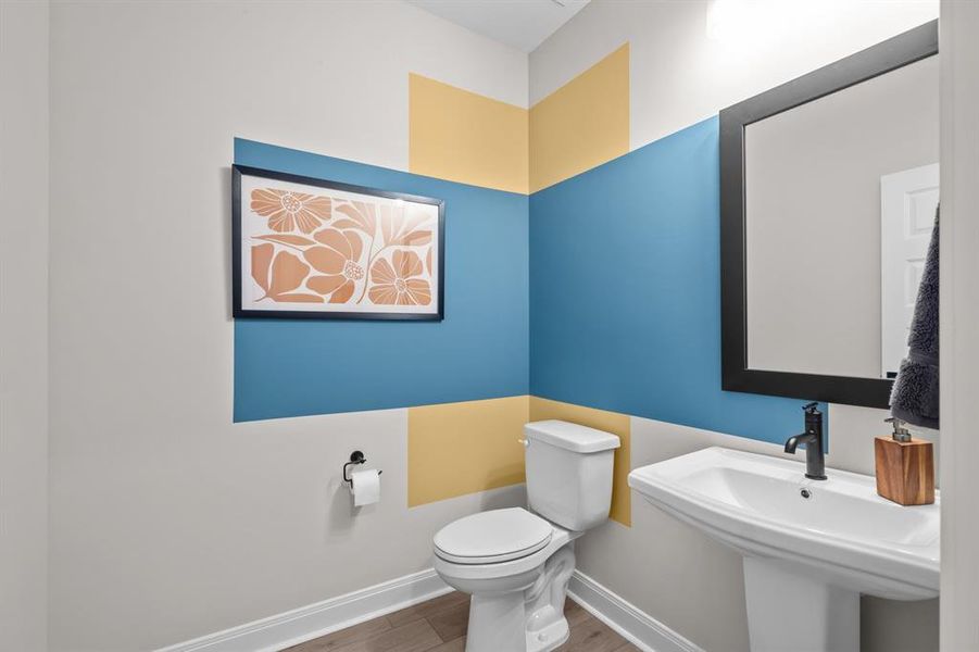 Bathroom featuring toilet and wood finished floors