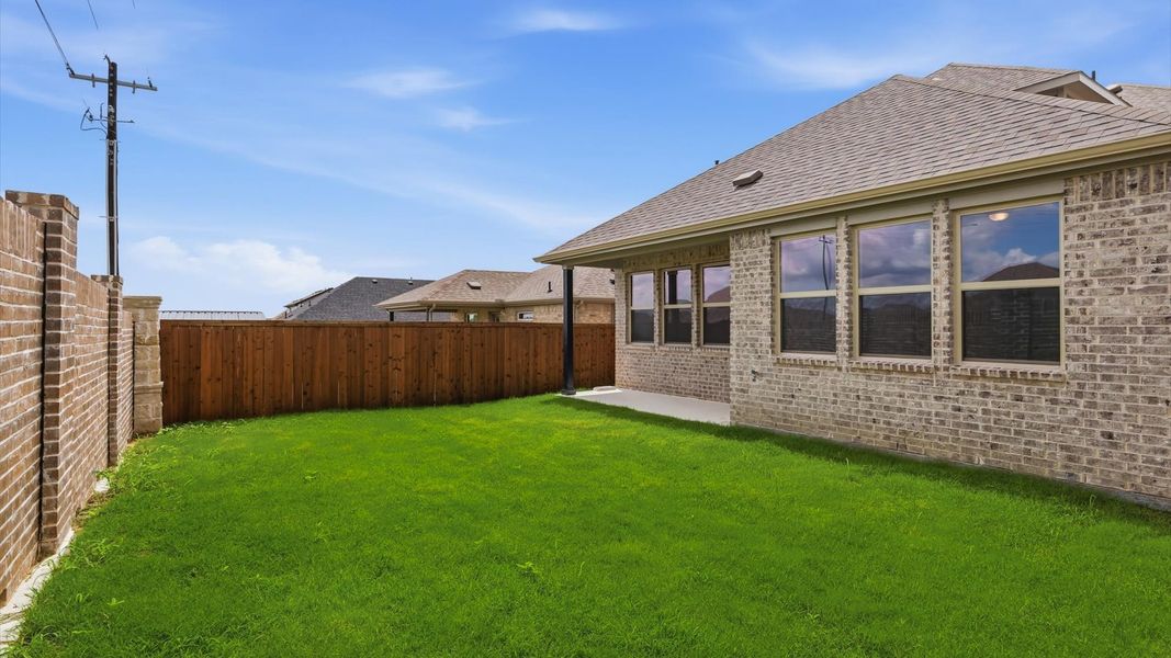 Exterior details and patio area of a home in Westridge Journey, Princeton (Image 26).