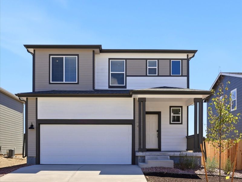 Front exterior of a new home in Lorson Ranch: The Trail Collection, Colorado Springs, CO, highlighting curb appeal (Image 1). Front exterior of a new home in Lorson Ranch: The Trail Collection, Colorado Springs, CO, highlighting curb appeal (Image 1).